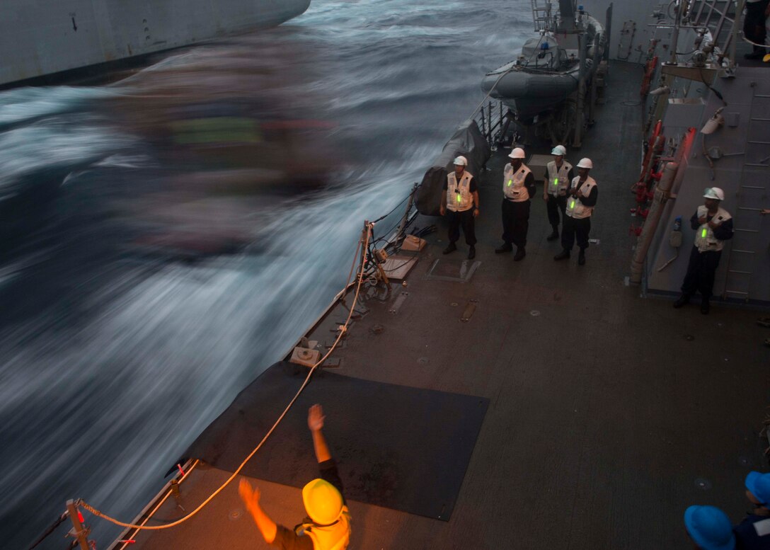 Sailors aboard the USS Bulkeley receive cargo during a replenishment at sea with the USNS William McLean in the Atlantic Ocean, Sept. 16, 2015. The Bulkeley is underway participating in a composite training unit exercise with the Harry S. Truman Carrier Strike Group. U.S. Navy photo by Petty Officer 3rd Class M.J. Lieberknecht