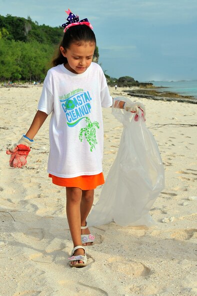 A Team Andersen family member participates in Guam’s 20th International Coastal Cleanup Sept. 19, 2015, at Tarague Beach on Andersen Air Force Base, Guam. More than 140 volunteers collected 22 bags of trash and 10 bags of recyclables from the base beach during the annual event. (U.S. Air Force photo by Tech. Sgt. Melissa B. White/Released)