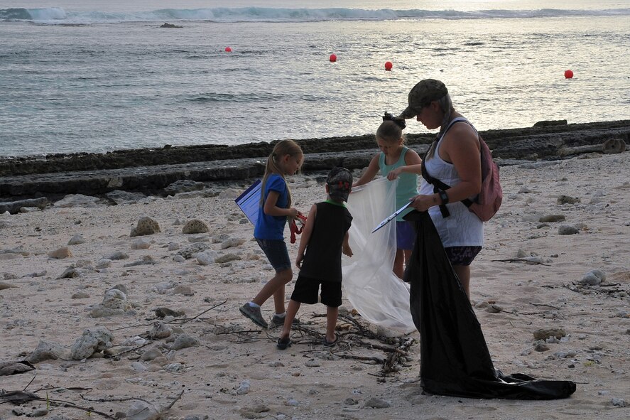 Team Andersen family members participate in Guam’s 20th International Coastal Cleanup Sept. 19, 2015, at Tarague Beach on Andersen Air Force Base, Guam. More than 140 volunteers collected 22 bags of trash and 10 bags of recyclables from the base beach during the annual event. (U.S. Air Force photo by Tech. Sgt. Melissa B. White/Released)