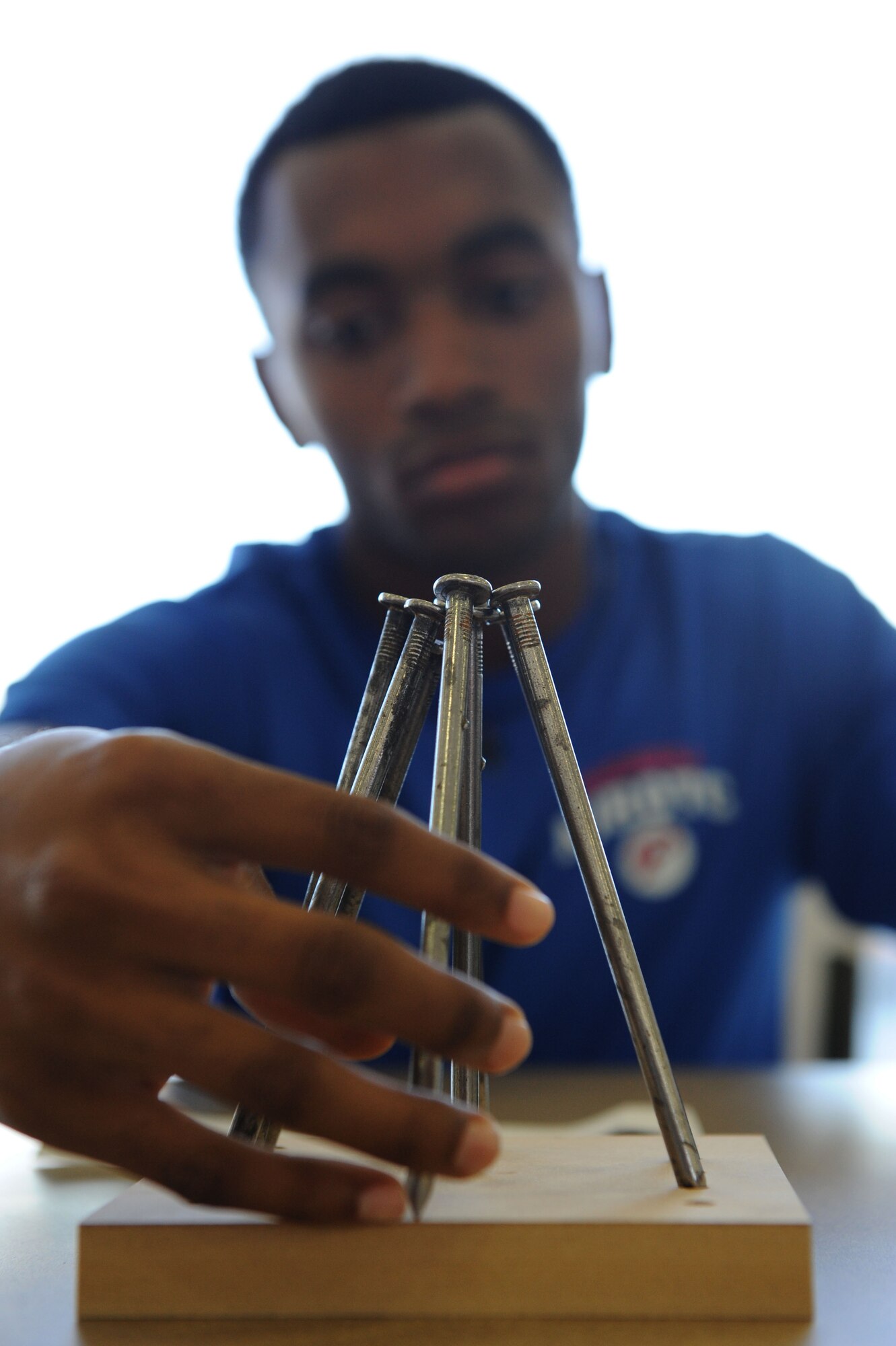 Goldarius Dortch, a Junior ROTC student at Pascagoula High School, participates in a “braniacs” task during the STEM (science, technology, engineering and mathematics) Diversity Outreach Day Sept. 18, 2015, at the fuel cell hangar, Keesler Air Force Base, Miss. The event consisted of 10 Mississippi gulf coast high school JROTC units and science students viewing a staged crime scene, participating in a “brainiacs” test and visiting informative booths about Air Force opportunities and accession requirements with an emphasis on STEM. (U.S. Air Force photo by Kemberly Groue)