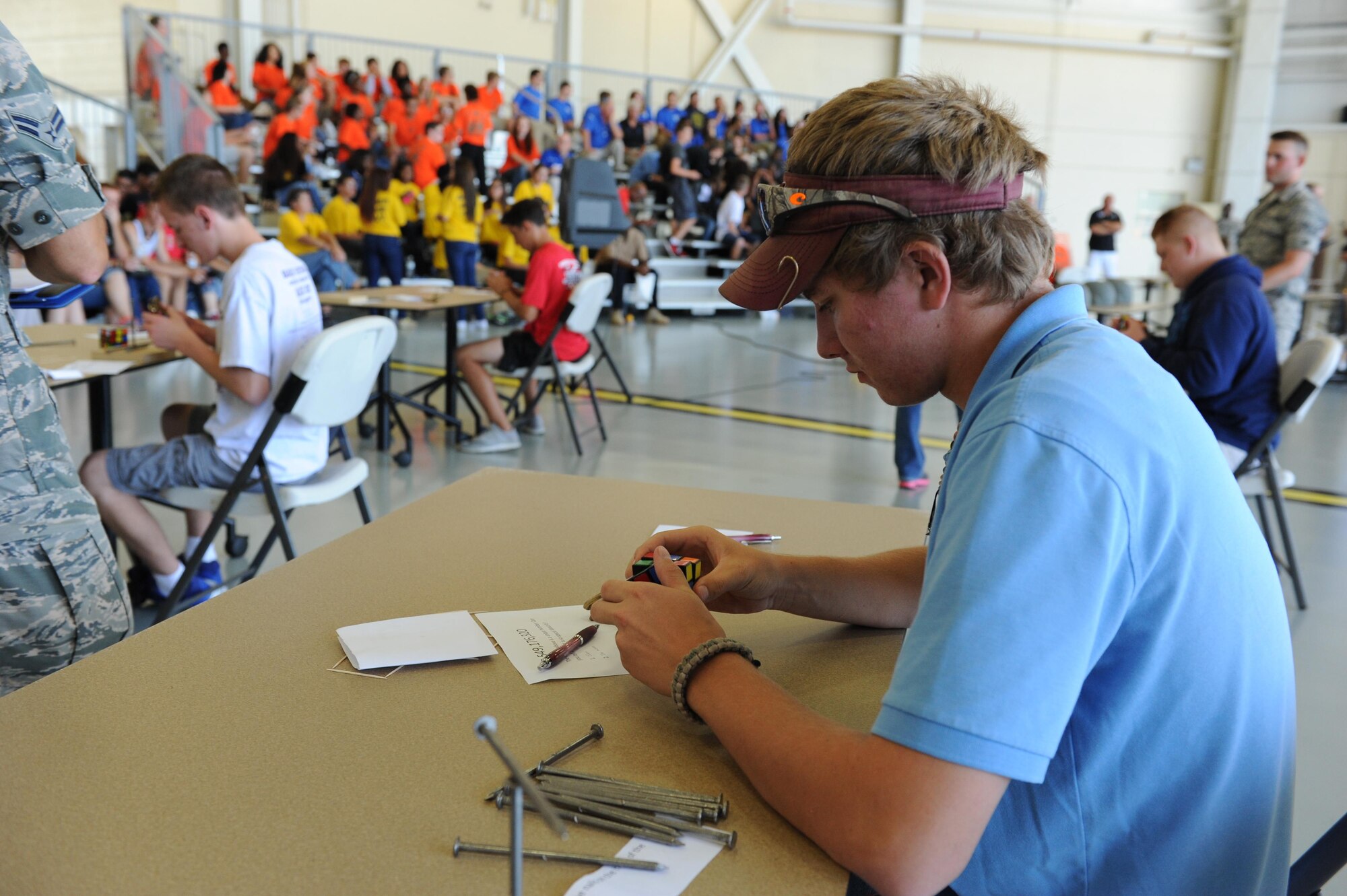 Nick Beckstein, a  Vancleave High School student, participates in a “braniacs” task during the STEM (science, technology, engineering and mathematics) Diversity Outreach Day Sept. 18, 2015, at the fuel cell hangar, Keesler Air Force Base, Miss. The event consisted of 10 Mississippi gulf coast high school Junior ROTC units and science students viewing a staged crime scene, participating in a “brainiacs” test and visiting informative booths about Air Force opportunities and accession requirements with an emphasis on STEM. (U.S. Air Force photo by Kemberly Groue)