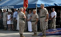 Sergeant Maj. William T. Sowers (left), sergeant major of 1st Marine Division, hands the division colors to Brig. Gen. Daniel D. Yoo (center) during the change of command ceremony in which Yoo passed command of the division to Maj. Gen. Daniel J. O’Donohue (right) aboard Marine Corps Base Camp Pendleton, Calif., Sept. 10, 2015. O’Donohue is taking command of the division after recently commanding Marine Corps Forces Cyberspace Command. (U.S. Marine Corps photo by Staff Sgt. Bobbie A. Curtis)