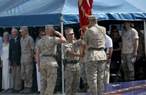 Brig. Gen. Daniel D. Yoo (center), hands the 1st Marine Division colors to Maj. Gen. Daniel J. O’Donohue (right) during the change of command ceremony, symbolizing the passing of duties and responsibilities as the commanding general, aboard Marine Corps Base Camp Pendleton, Calif., Sept. 10, 2015. O’Donohue is taking command of the division after recently commanding Marine Corps Forces Cyberspace Command. (U.S. Marine Corps photo by Staff Sgt. Bobbie A. Curtis)