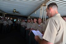 A Marine with 3rd Battalion, 4th Marines, 7th Marine Regiment, 1st Marine Division, reads a written recollection of the first Thunder Mug Ceremony in history during a ceremony following the reactivation of 3/4 aboard Marine Air Ground Combat Center Twentynine Palms, Calif., Sept. 17, 2015. The Marine Corps’ reactivation of the “Thundering Third” officially starts Oct. 1, 2015, which marks exactly 90 years of dedicated service within the Corps.