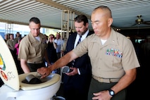 Lieutenant Colonel Brian S. Middleton, commanding officer of 3rd Battalion, 4th Marines, 7th Marine Regiment, 1st Marine Division, fills his canteen cup with French 75 during the unit’s  Thunder Mug Ceremony aboard Marine Air Ground Combat Center Twentynine Palms, Calif., Sept. 17, 2015. 3/4 took part in the Thunder Mug Ceremony after the reactivation ceremony of the battalion. The Marine Corps’ reactivation of the “Thundering Third” officially starts Oct. 1, 2015, which marks exactly 90 years of dedicated service within the Corps.