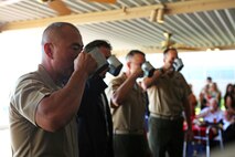 Lieutenant Colonel Brian S. Middleton, the commanding officer of 3rd Battalion, 4th Marines, 7th Marine Regiment, 1st Marine Division, takes part in the unit’s Thunder Mug Ceremony aboard Marine Air Ground Combat Center Twentynine Palms, Calif., Sept. 17, 2015. 3/4 took part in the Thunder Mug Ceremony after reactivating the battalion. The Marine Corps’ reactivation of the “Thundering Third” officially starts Oct. 1, 2015, which marks exactly 90 years of dedicated service within the Corps.