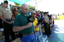 Marines with 3rd Battalion, 4th Marines, 7th Marine Regiment, 1st Marine Division and Marine Corps veterans pray during the 3/4  reactivation ceremony aboard Marine Air Ground Combat Center Twentynine Palms, Calif., Sept. 17, 2015. The Marine Corps’ reactivation of the “Thundering Third” officially starts Oct. 1, 2015, which marks exactly 90 years of dedicated service within the Corps.