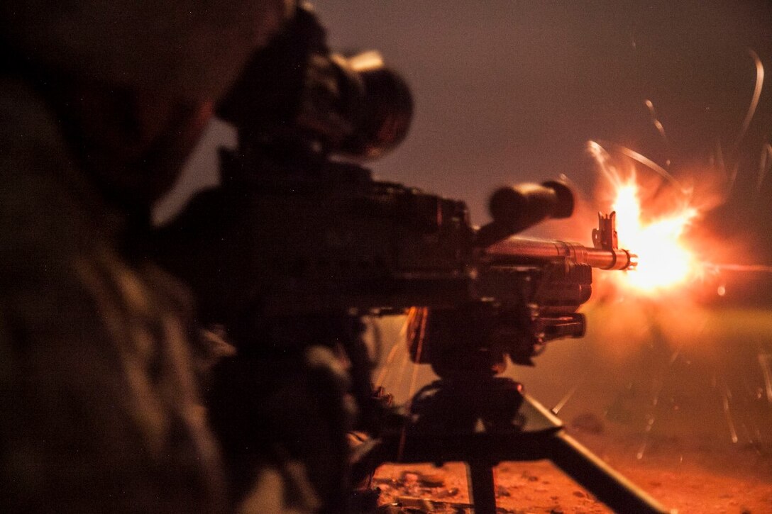 KUWAIT(Aug. 25, 2015)  A U.S. Marine with Lima Company, Battalion Landing Team 3rd Battalion, 1st Marine Regiment, 15th Marine Expeditionary, fires an M240B machine gun during a night live-fire training exercise. Elements of the 15th MEU are ashore in Kuwait for sustainment training to maintain and enhance the skills they developed during their pre-deployment training period.  The 15th MEU is embarked aboard the Essex Amphibious Ready Group and deployed to maintain regional security in the U.S. 5th Fleet area of operations. (U.S. Marine Corps photo by Cpl. Elize McKelvey/ Released)