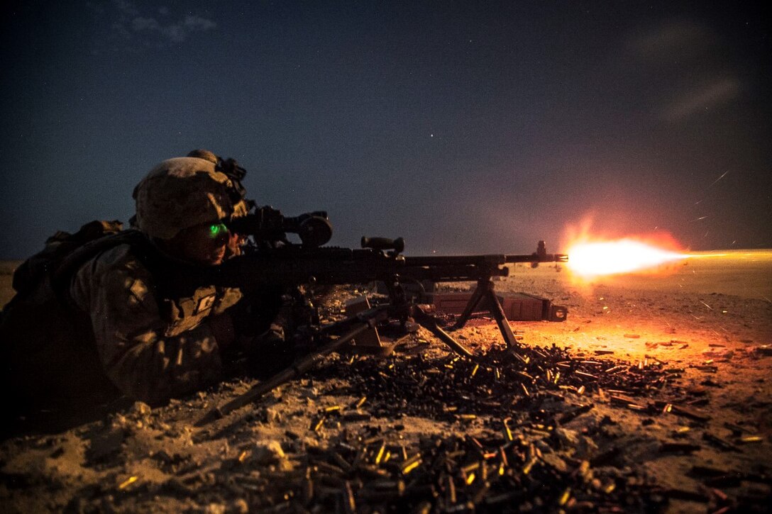 KUWAIT (Aug. 25, 2015)  U.S. Marines with Lima Company, Battalion Landing Team 3rd Battalion, 1st Marine Regiment, 15th Marine Expeditionary, fires an M240B machine gun during a night live-fire training exercise. Elements of the 15th MEU are ashore in Kuwait for sustainment training to maintain and enhance the skills they developed during their pre-deployment training period.  The 15th MEU is embarked aboard the Essex Amphibious Ready Group and deployed to maintain regional security in the U.S. 5th Fleet area of operations. (U.S. Marine Corps photo by Cpl. Elize McKelvey/Released)