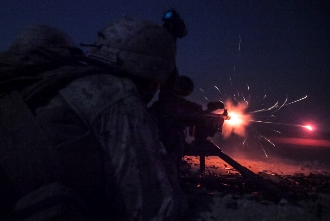 KUWAIT (Aug. 25, 2015)  A U.S. Marine with Lima Company, Battalion Landing Team 3rd Battalion, 1st Marine Regiment, 15th Marine Expeditionary, fires an M240B machine gun during a night live-fire training exercise. Elements of the 15th MEU are ashore in Kuwait for sustainment training to maintain and enhance the skills they developed during their pre-deployment training period.  The 15th MEU is embarked aboard the Essex Amphibious Ready Group and deployed to maintain regional security in the U.S. 5th Fleet area of operations. (U.S. Marine Corps photo by Cpl. Elize McKelvey/ Released)