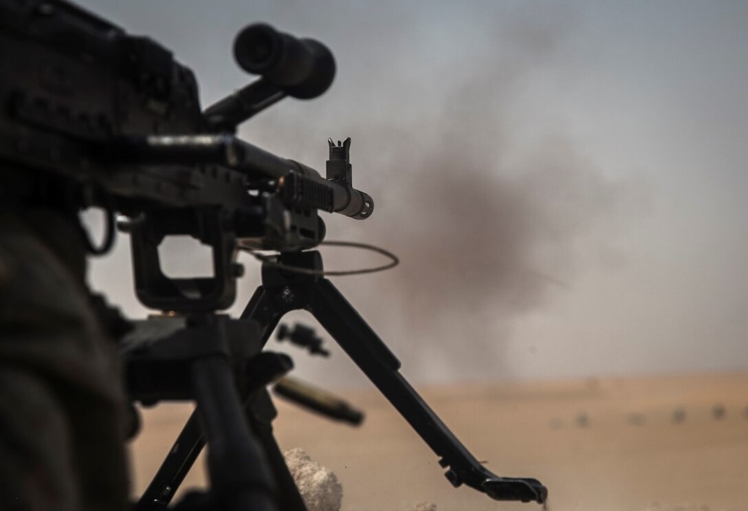 KUWAIT (Aug. 26, 2015) A U.S. Marine with Lima Compnay, Battalion Landing Team 3rd Battalion, 1st Marine Regiment, 15th Marine Expeditionary Unit, fires an M240B machine gun  during a live-fire training exercise. Elements of the 15th MEU are ashore in Kuwait for sustainment training to maintain and enhance the skills they developed during their pre-deployment training period.  The 15th MEU is embarked aboard the Essex Amphibious Ready Group and deployed to maintain regional security in the U.S. 5th Fleet area of operations. (U.S. Marine Corps photo by Cpl. Elize McKelvey/Released)