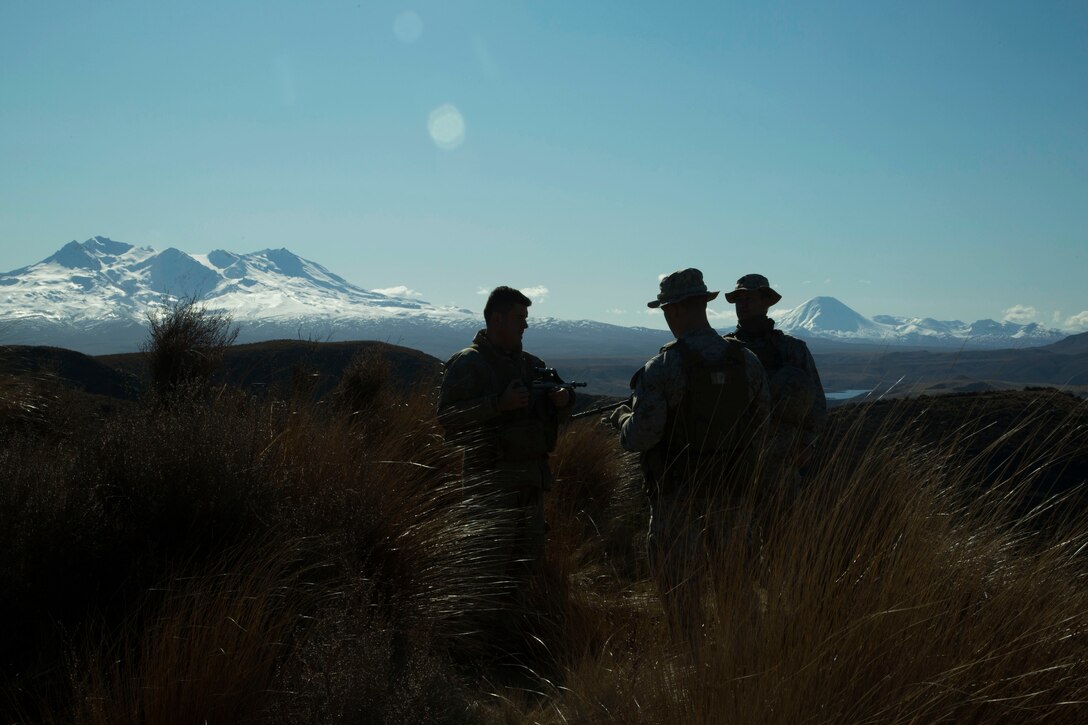 New Zealand Army Soldiers and U.S. Marines arrive to Waiouru Military Training Area, New Zealand, during exercise Joint Assault Signals Company Black, Aug. 27, 2015. Kiwi soldiers and U.S. Marines collectively called for fire utilizing 81mm mortars. They conducted immediate neutralization, danger close, smoke and coordinated illuminated missions. Kiwi soldiers are with 161 Battery, 16th Field Regiment.  Marines are with 5th Air Naval Gunfire Liaison Company, III Marine Expeditionary Force Headquarters Group, III MEF.