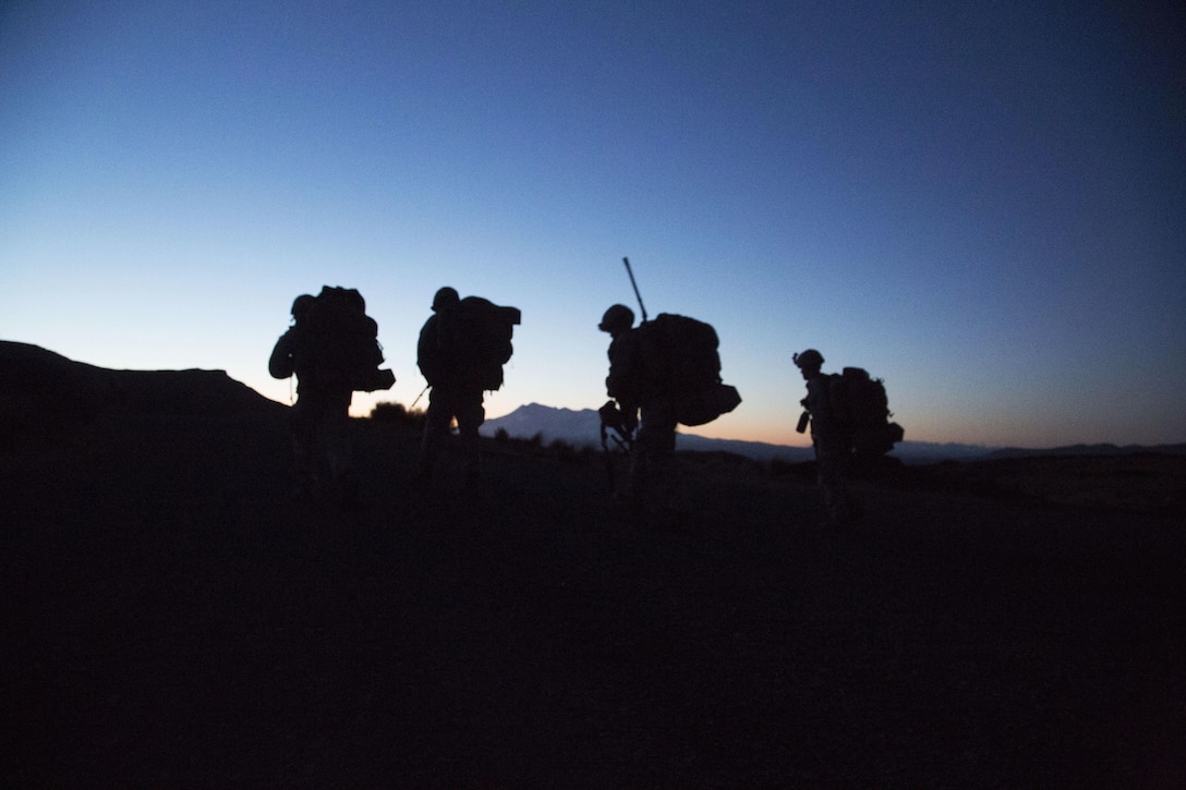 U.S. Marines hike to their designated observation post at Waiouru Military Training Area, New Zealand, during exercise Joint Assault Signals Company Black, Aug. 27, 2015. New Zealand Army Soldiers and U.S. Marines collectively called for fire utilizing 81mm mortars. They conducted immediate neutralization, danger close, smoke and coordinated illuminated missions. Kiwi soldiers are with 161 Battery, 16th Field Regiment. Marines are with 5th Air Naval Gunfire Liaison Company, III Marine Expeditionary Force Headquarters Group, III MEF.