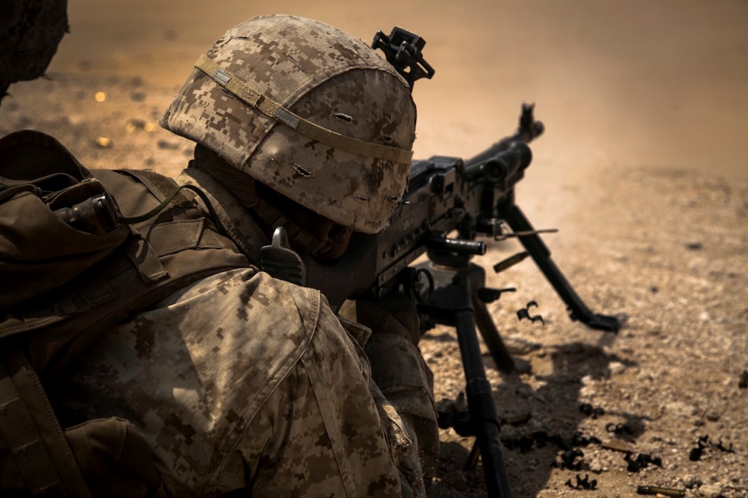KUWAIT (Aug. 26, 2015)  A U.S. Marine with Lima Company, Battalion Landing Team 3rd Battalion, 1st Marine Regiment, 15th Marine Expeditionary Unit, fires an M240B machine gun  during a live-fire training exercise. Elements of the 15th MEU are ashore in Kuwait for sustainment training to maintain and enhance the skills they developed during their pre-deployment training period.  The 15th MEU is embarked aboard the Essex Amphibious Ready Group and deployed to maintain regional security in the U.S. 5th Fleet area of operations. (U.S. Marine Corps photo by Cpl. Elize McKelvey/Released)