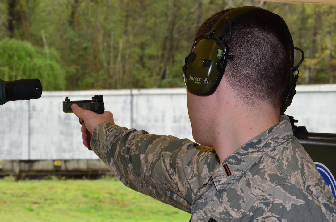 Air Force 2nd Lt. Tucker Sears, the 436th Logistics Readiness Squadron material management officer in charge, fires a .22-caliber pistol during an Air Force National Pistol Team camp March 24, 2015, at Fort Benning, Ga. Sears earned a spot on the Air Force National Pistol Team at the camp. U.S. Air Force photo by Lt. Col. Hugh M. Ragland