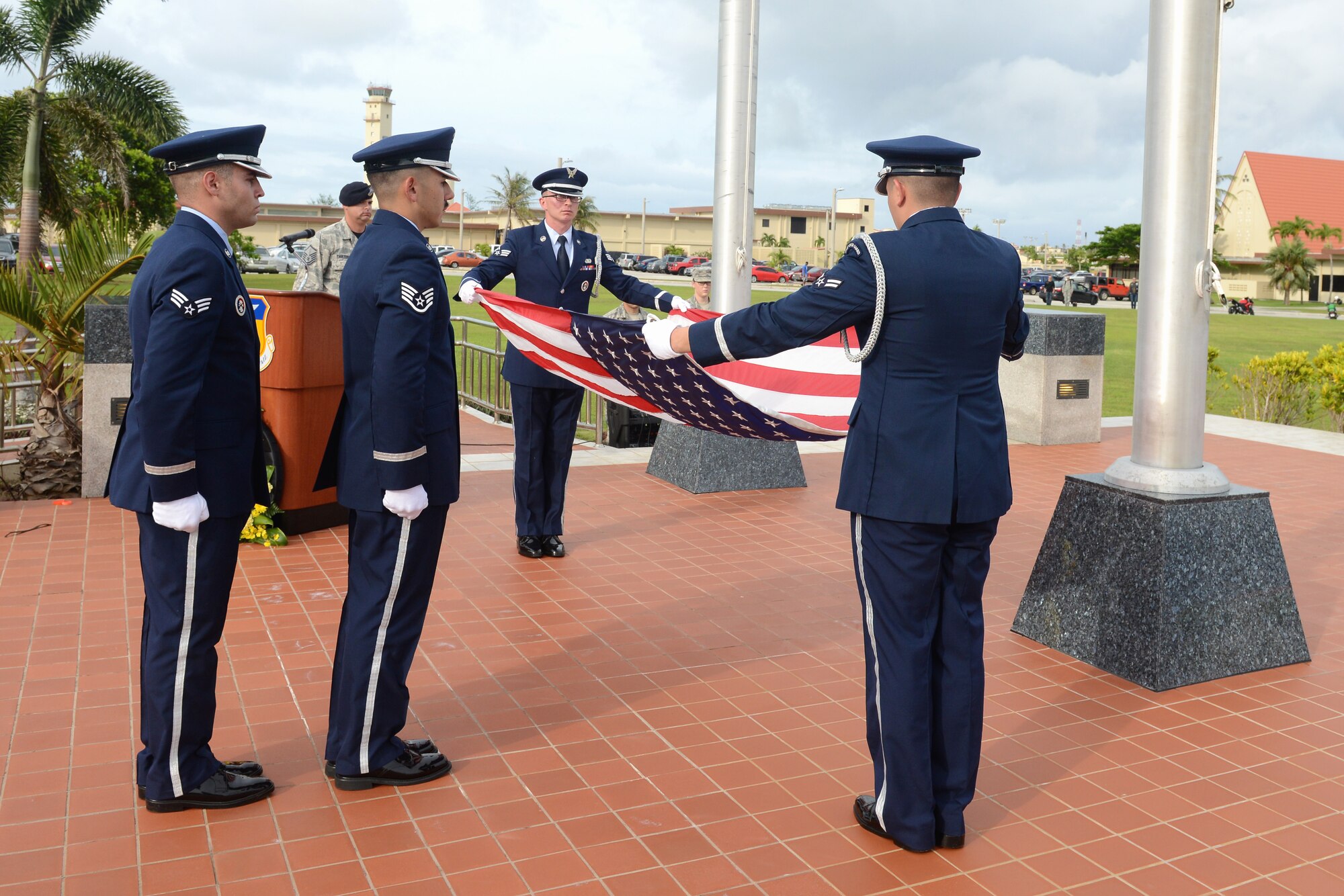 Andersen Air Force Base Honor Guardsmen fold the U.S. flag during a POW/MIA retreat ceremony held Sept. 18, 2015, on Andersen Air Force Base, Guam. The retreat ceremony ended the week’s events that included a ruck march, a 5K run and a 24 hour vigilance run. (U.S. Air Force photo by Airman 1st Class Arielle Vasquez/Released)