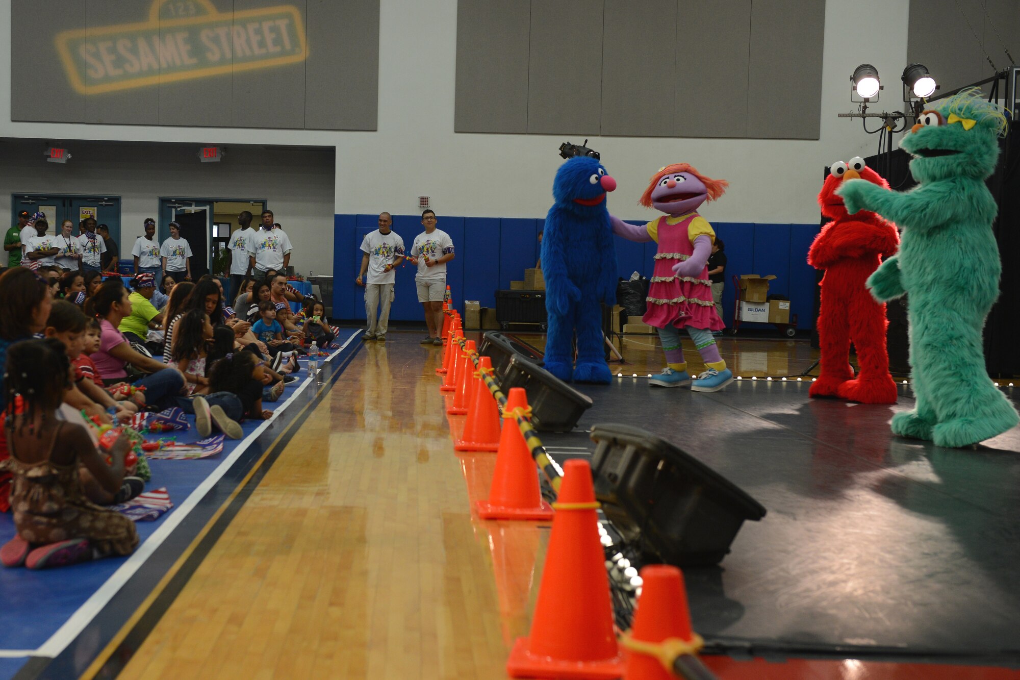 Katie, a Sesame Street character, seeks comfort from her friends during the Sesame Street United Service Organizations Experience for Military Families performance Sept. 19, 2015, on Andersen Air Force Base, Guam. The tour showcased friendship when the Sesame Street characters helped Katie open up about her fears and excitement with moving to a new base and making new friends. (U.S. Air Force photo by Airman 1st Class Arielle Vasquez/Released)