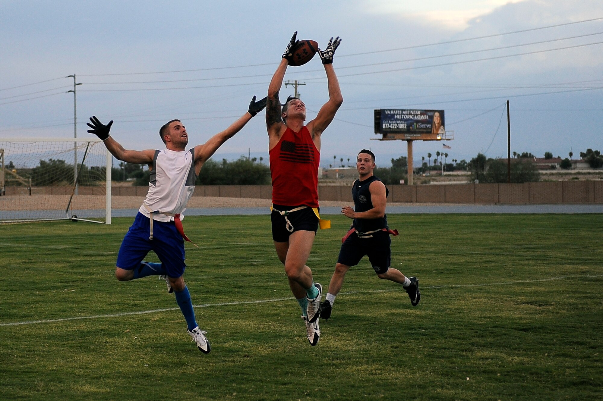 Dylan Vogal attempts to catch a touchdown pass Sept. 8, 2015, at Luke Air Force Base, Arizona.  The 56th Medical Group team earned its second win in the intramural bracket.(U.S. Air Force photo by Airman Pedro Mota) 