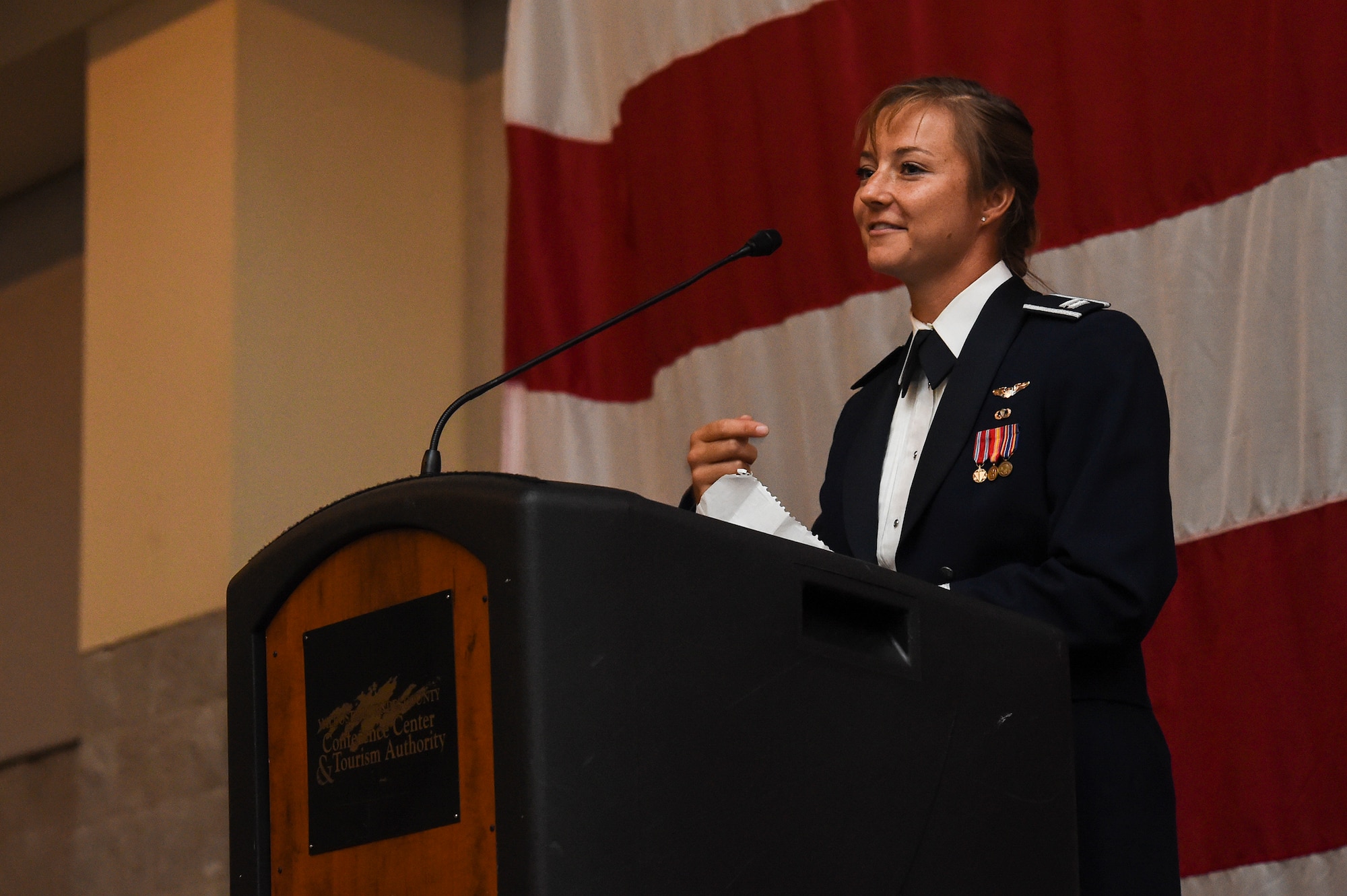 U.S. Air Force Capt. Christy Wise, 71st Rescue Squadron HC-130 pilot, addresses the crowd during the Air Force Ball Sept. 19, 2015, in Valdosta, Ga. Wise spoke about the events that led up to her boating accident, how she persevered after becoming an amputee and offered words of motivation to those in attendance. (U.S. Air Force photo by Senior Airman Ceaira Tinsley/Released)