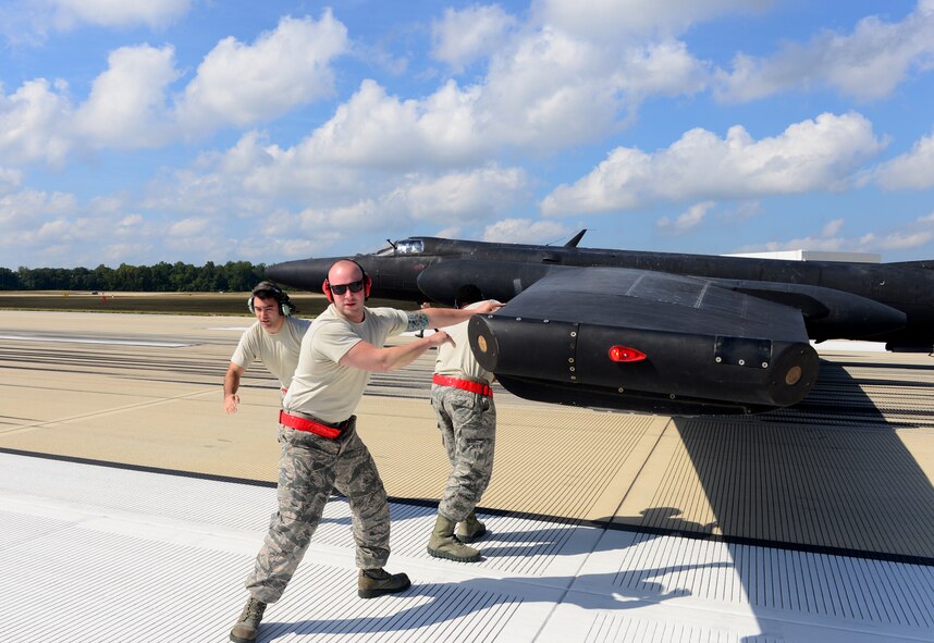 Airmen from the 9th Aircraft Maintenance Squadron, Beale Air Force Base, California, install pogos underneath the wings of a U-2 Dragon Lady during an air show at Joint Base Andrews, Maryland, Sep. 19, 2015. This year marks the 60th anniversary of the U-2, one of the oldest operational aircraft in the Department of Defense. (U.S. Air Force photo by Senior Airman Bobby Cummings)  