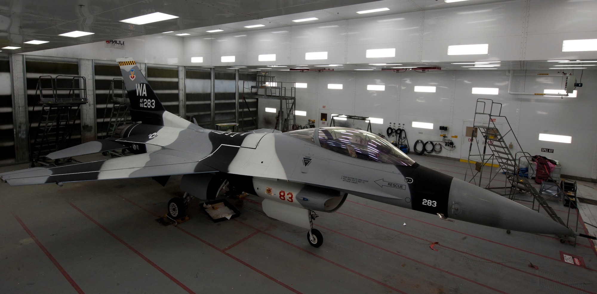 A repainted F-16 Fighting Falcon sits inside a temperature-controlled room on Nellis Air Force Base, Nev., Sept. 14, 2015. There are nine different paint schemes, but of those nine, six are used on F-16s. (U.S. Air Force photo by Airman 1st Class Mikaley Kline)