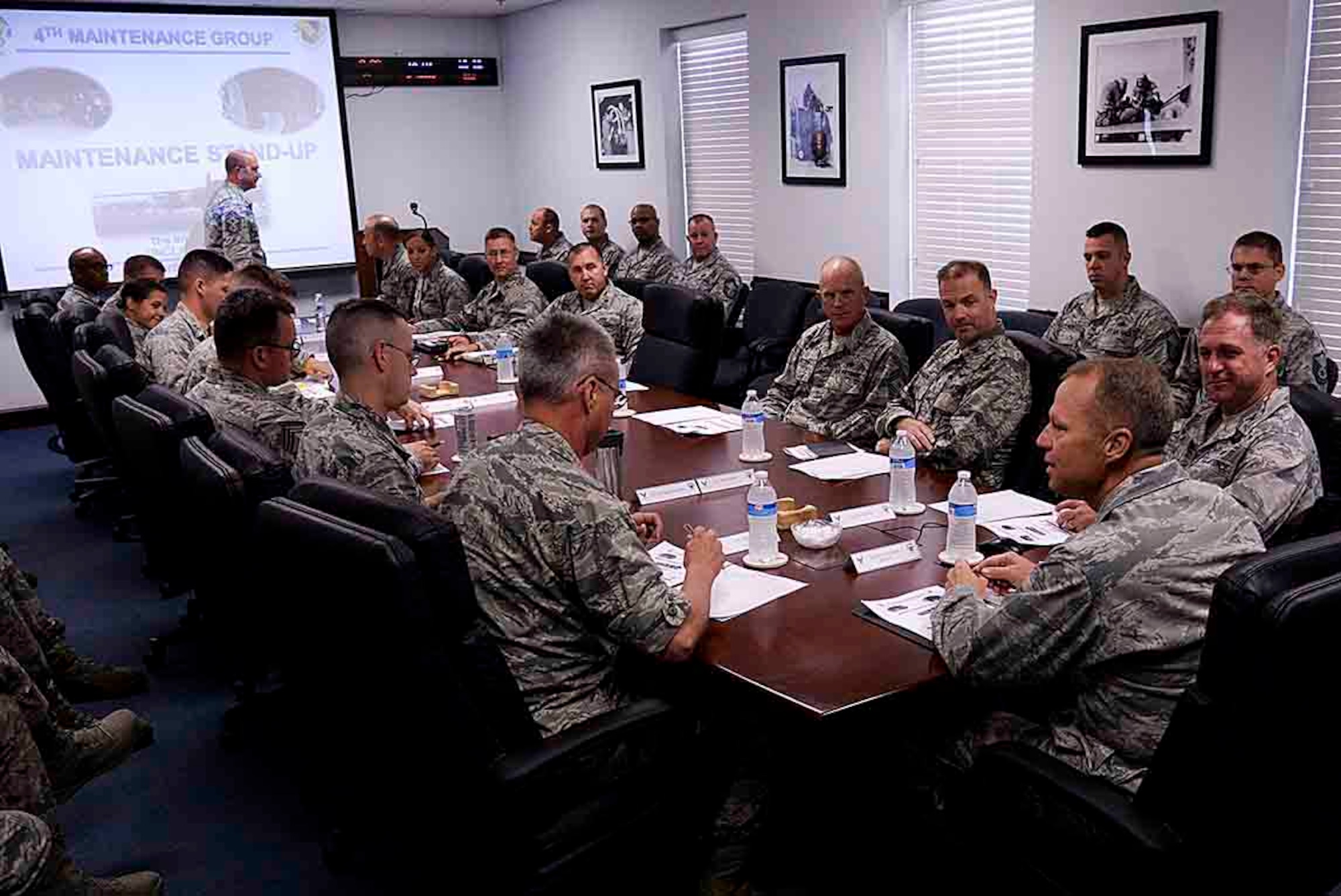Leaders of the 4th Fighter Wing and 4th Maintenance Group conduct a maintenance stand-up with Maj. Gen. Mark Kelly, 9th Air Force commander, Sept. 14, 2015, at Seymour Johnson Air Force Base, North Carolina. Kelly attended the meeting to get spun up on the happenings of the more than 90 F-15E Strike Eagle aircraft assigned to the 4th FW. (U.S. Air Force photo/Senior Airman Brittain Crolley)