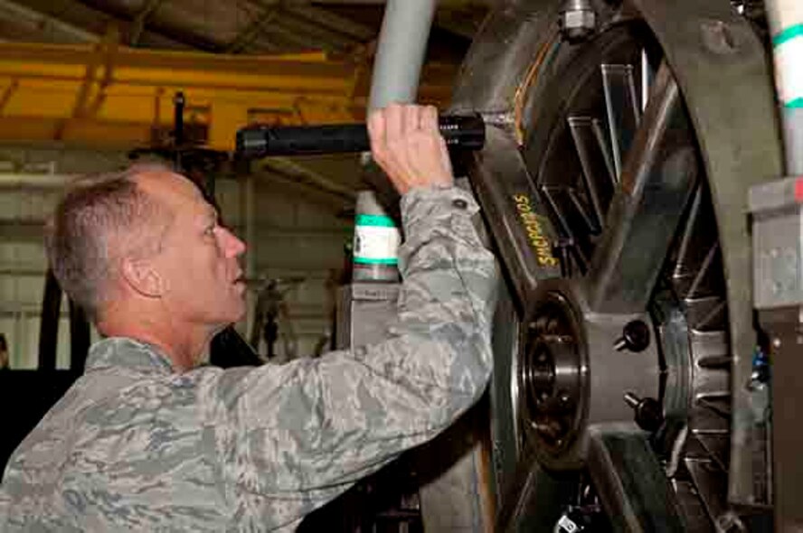 Maj. Gen. Mark Kelly, 9th Air Force commander, inspects the engine of an F-15E Strike Eagle aircraft, Sept. 14, 2015, at Seymour Johnson Air Force Base, North Carolina. Kelly visited multiple maintenance shops during his visit to Seymour Johnson AFB to further immerse himself in the mission of the 4th Fighter Wing. (U.S. Air Force photo/Airman 1st Class Shawna L. Keyes)