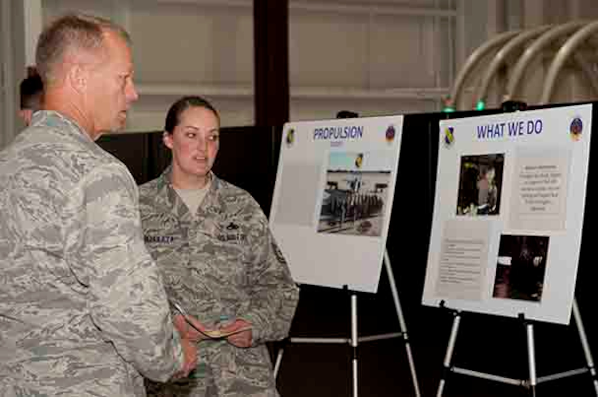 Senior Master Sgt. Amy Archuleta (right), 4th Component Maintenance Squadron propulsion flight chief, briefs Maj. Gen. Mark Kelly, 9th Air Force commander, on the importance and daily happenings of the propulsion shop, Sept. 14, 2015, at Seymour Johnson Air Force Base, North Carolina. The propulsion flight’s mission is to supply war ready engines in support of 94 F-15E aircraft to conduct aircrew training and support real-world contingency operations. (U.S. Air Force photo/Airman 1st Class Shawna L. Keyes)
