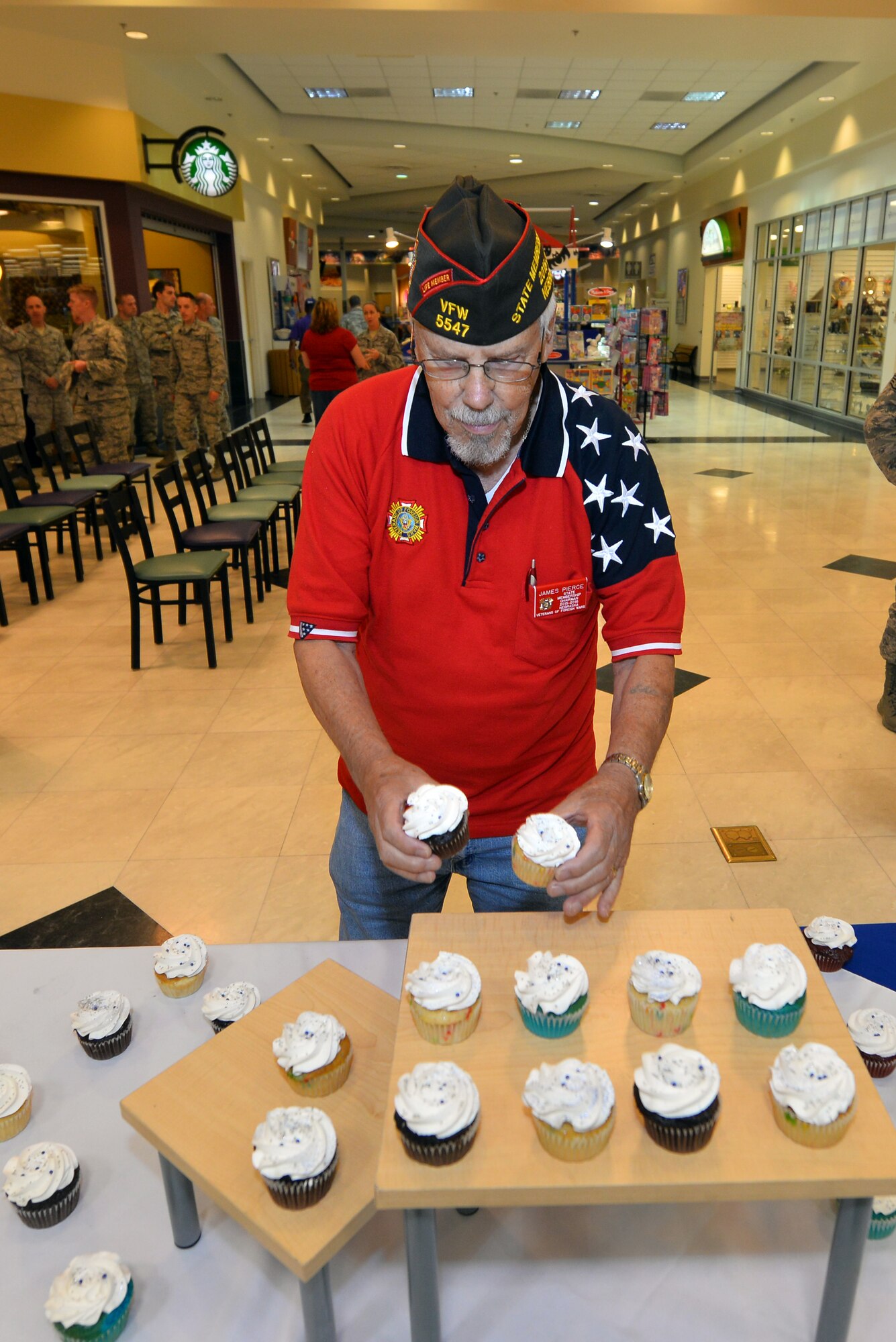 James Pierce, a state membership chairman with the Nebraska Veterans of Foreign Wars, grabs a cupcake at an Air Force birthday celebration hosted at the Offutt Exchange on Sept. 18, Offutt Air Force Base, Neb.  The Air Force was created in 1947.  (U.S. Air Force photo by Josh Plueger/Released)