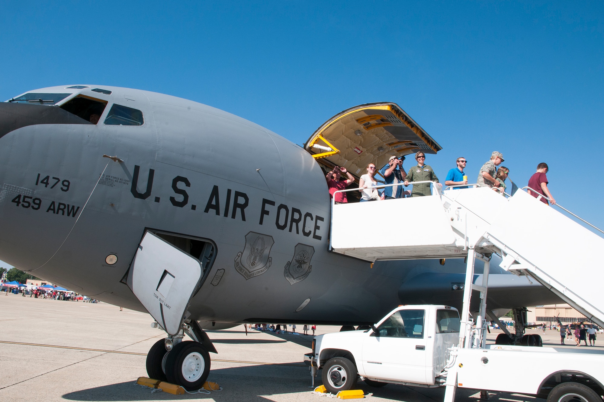 Patrons exit a 459th Air Refueling Wing KC-135R Stratotanker on the Joint Base Andrews flight line after touring the interior during the JBA Air Show Sept. 18, 2015.The 459th Airlift Wing provided tours of the aircraft and illustrated medical and refueling capabilities to the public during the open house. (U.S. Air Force photo/Staff Sgt. Kat Justen)