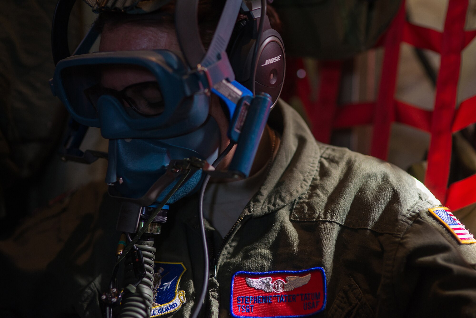 Tech. Sgt. Stephenie Tatum, 137th Aeromedical Evacuation Squadron medical technician, tests her oxygen mask during a simulated rapid decompression on a C-130 Hercules flown by the 130th Airlift Wing, West Virginia ANG, as part of a joint ANG training mission, Sep. 12, 2015. The training helped 137 AES Airmen experience different airframes and new flight crews while maintaining flight readiness. (U.S. Air National Guard photo by Senior Airman Tyler Woodward/Released)