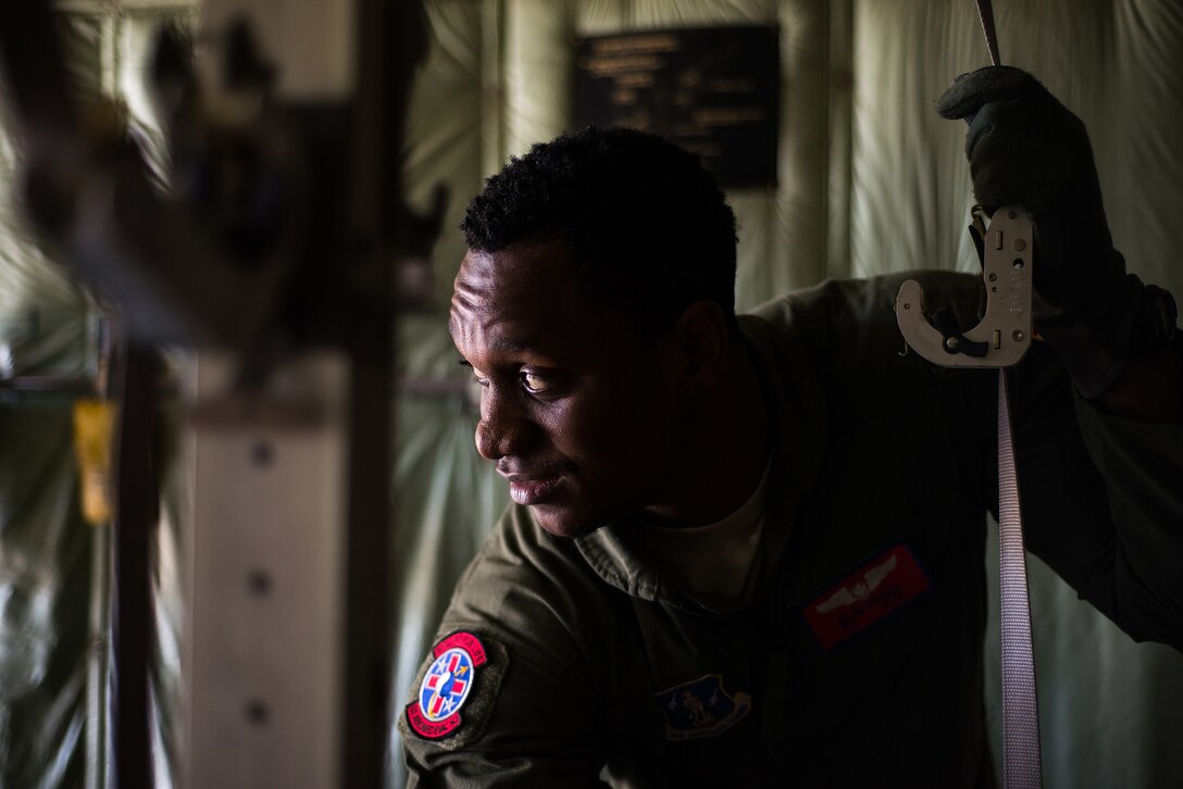 Airman 1st Class Devin Bruner, 137th Aeromedical Evacuation Squadron, secures a harness on a C-130 Hercules flown by the 130th Airlift Wing, West Virginia ANG, at Will Rogers Air National Guard Base, Oklahoma City, Sep. 12, 2015. The joint ANG training mission helped 137 AES Airmen experience different airframes and new flight crews while maintaining flight readiness. (U.S. Air National Guard photo by Senior Airman Tyler Woodward/Released) 