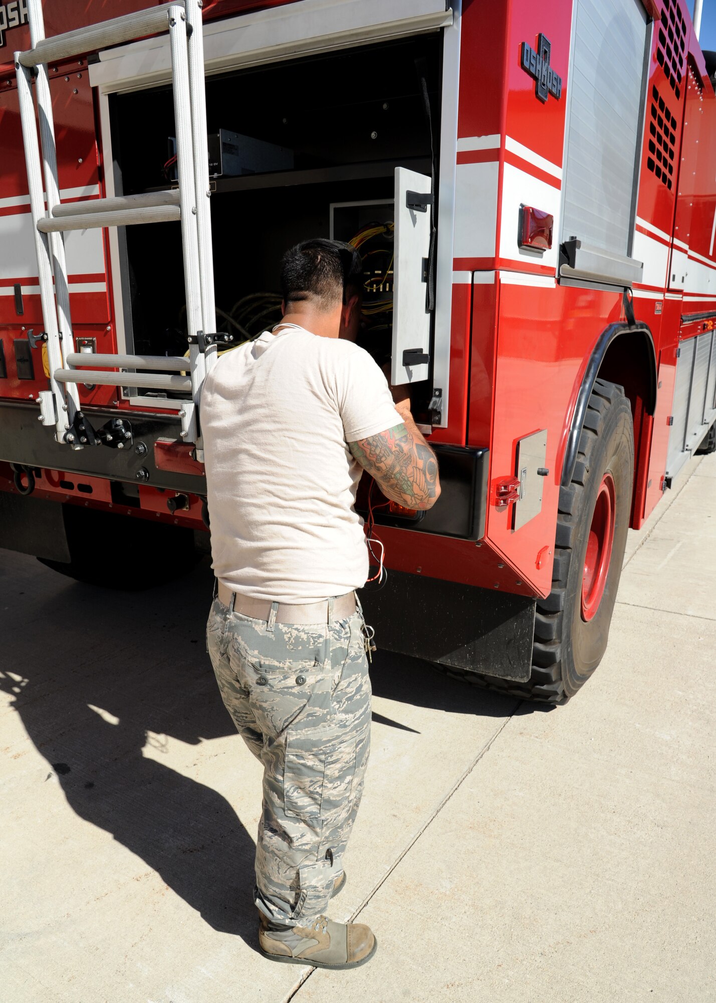 Tech. Sgt. Luis Ochoa, 319th Logistics Readiness Squadron NCO-in-charge of special purpose maintenance, works to identify an issue with a fire truck Sept. 21, 2015, on Grand Forks Air Force Base, North Dakota. The 319th LRS is scheduled to provide free vehicle inspections Sept. 26, 2015, in preparation for winter. (U.S. Air Force photo by Airman 1st Class Ryan Sparks/Released)