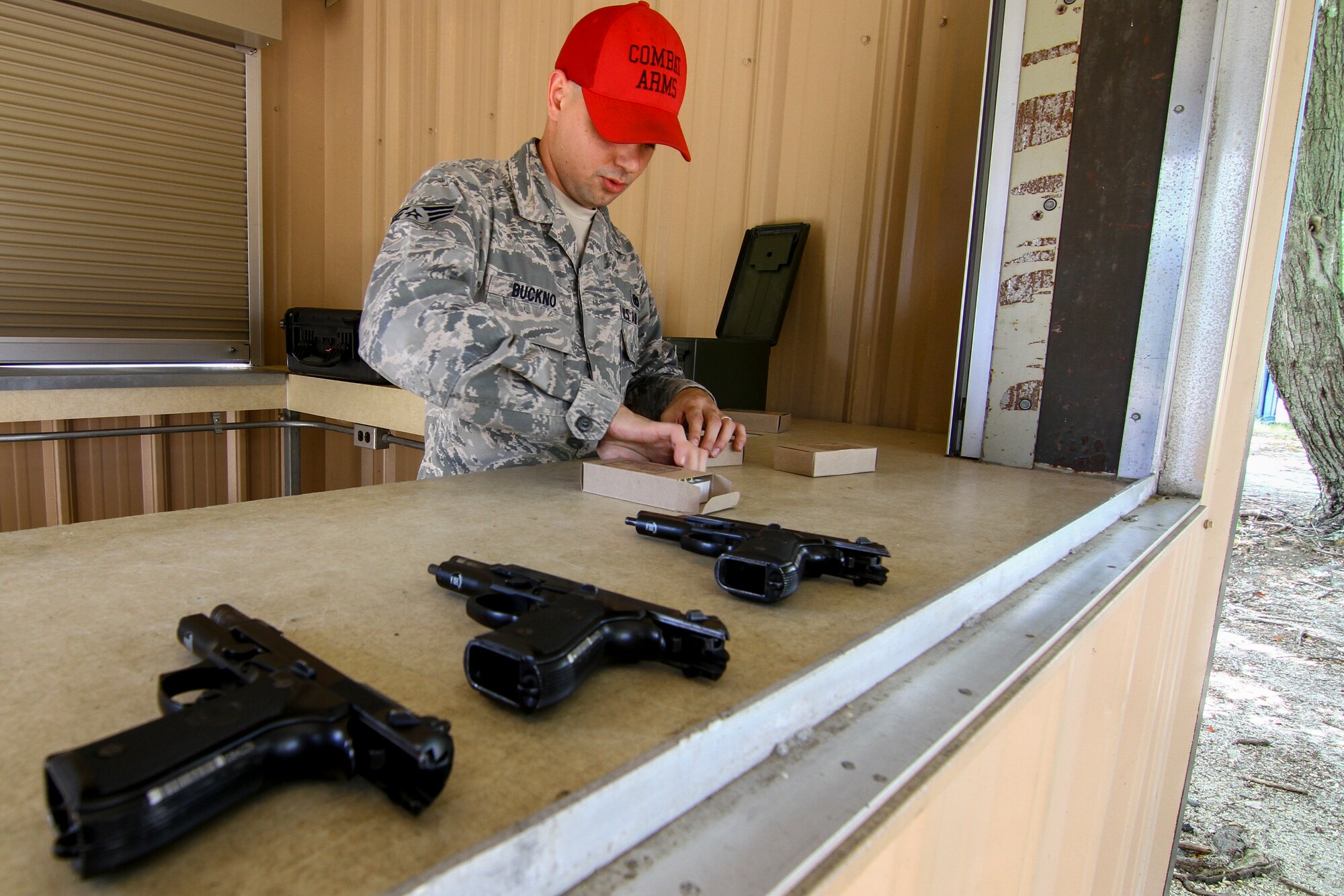 U.S. Air Force Senior Airman Raymond Buckno from the New Jersey Air National Guard's 108th Security Forces Squadron prepares 9mm ammunition for M9 pistol qualification firing at Joint Base McGuire-Dix-Lakehurst, N.J., Sept. 19, 2015. Buckno is a combat arms, training, and maintenance instructor. (U.S. Air National Guard photo by Tech. Sgt. Matt Hecht/Released)