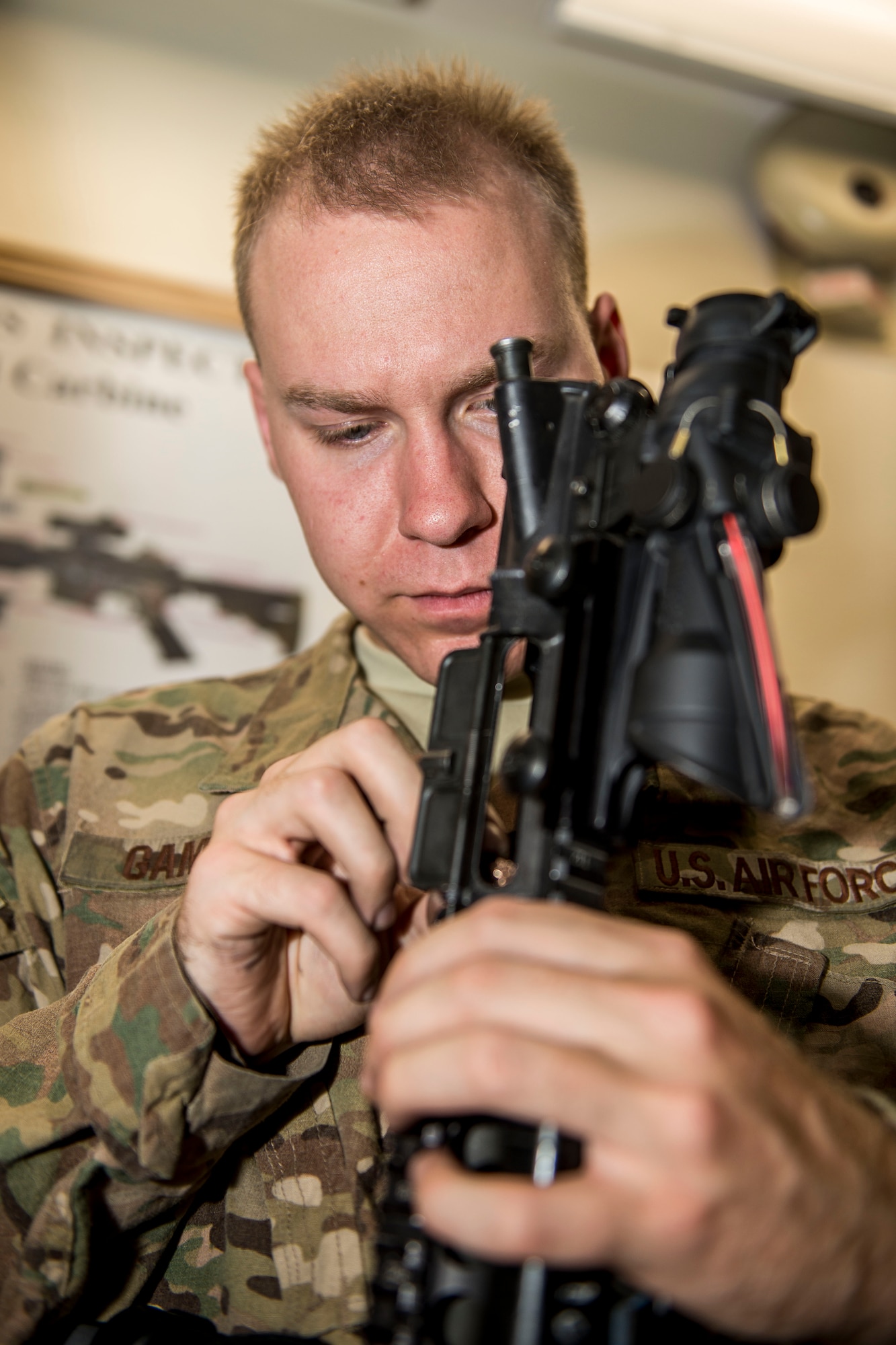 Airman Ian Gamage, 791st Security Forces Squadron response force leader, cleans his M4 carbine at the 5th Security Forces Armory at Minot Air Force Base, N.D., September 18, 2015. If weapons systems are not cleaned regularly, dirt, sand or carbon buildup may keep the magazine from feeding or cause the weapon to malfunction. (U.S. Air Force photo/ Airman 1st Class Justin T. Armstrong)