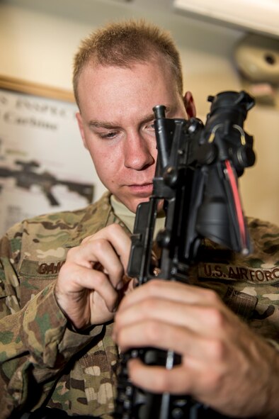 Airman Ian Gamage, 791st Security Forces Squadron response force leader, cleans his M4 carbine at the 5th Security Forces Armory at Minot Air Force Base, N.D., September 18, 2015. If weapons systems are not cleaned regularly, dirt, sand or carbon buildup may keep the magazine from feeding or cause the weapon to malfunction. (U.S. Air Force photo/ Airman 1st Class Justin T. Armstrong)