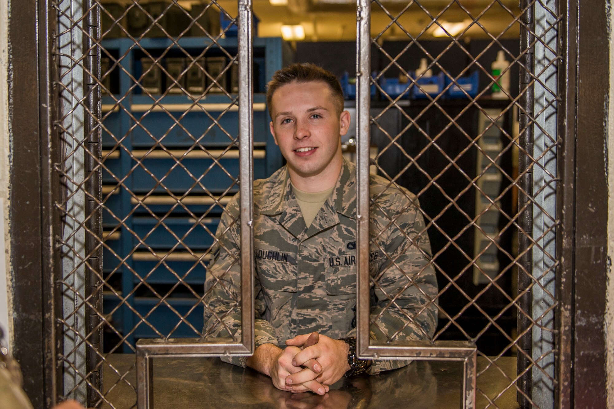 Airman 1st Class Dalton Loughlin, 5th Security Forces Squadron staff armorer, stands at the counter of the 5th Security Forces Armory at Minot Air Force Base, N.D., September 18, 2015. Security Forces Airmen are required to check their weapons in and out at the Armory daily. (U.S. Air Force photo/ Airman 1st Class Justin T. Armstrong)