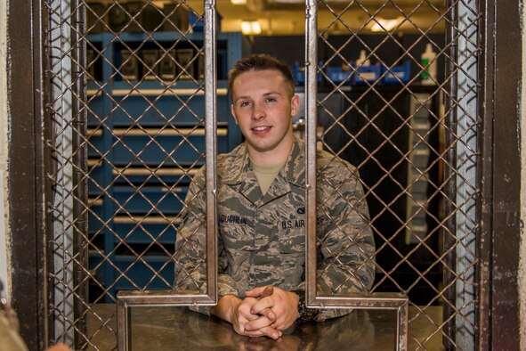 Airman 1st Class Dalton Loughlin, 5th Security Forces Squadron staff armorer, stands at the counter of the 5th Security Forces Armory at Minot Air Force Base, N.D., September 18, 2015. Security Forces Airmen are required to check their weapons in and out at the Armory daily. (U.S. Air Force photo/ Airman 1st Class Justin T. Armstrong)