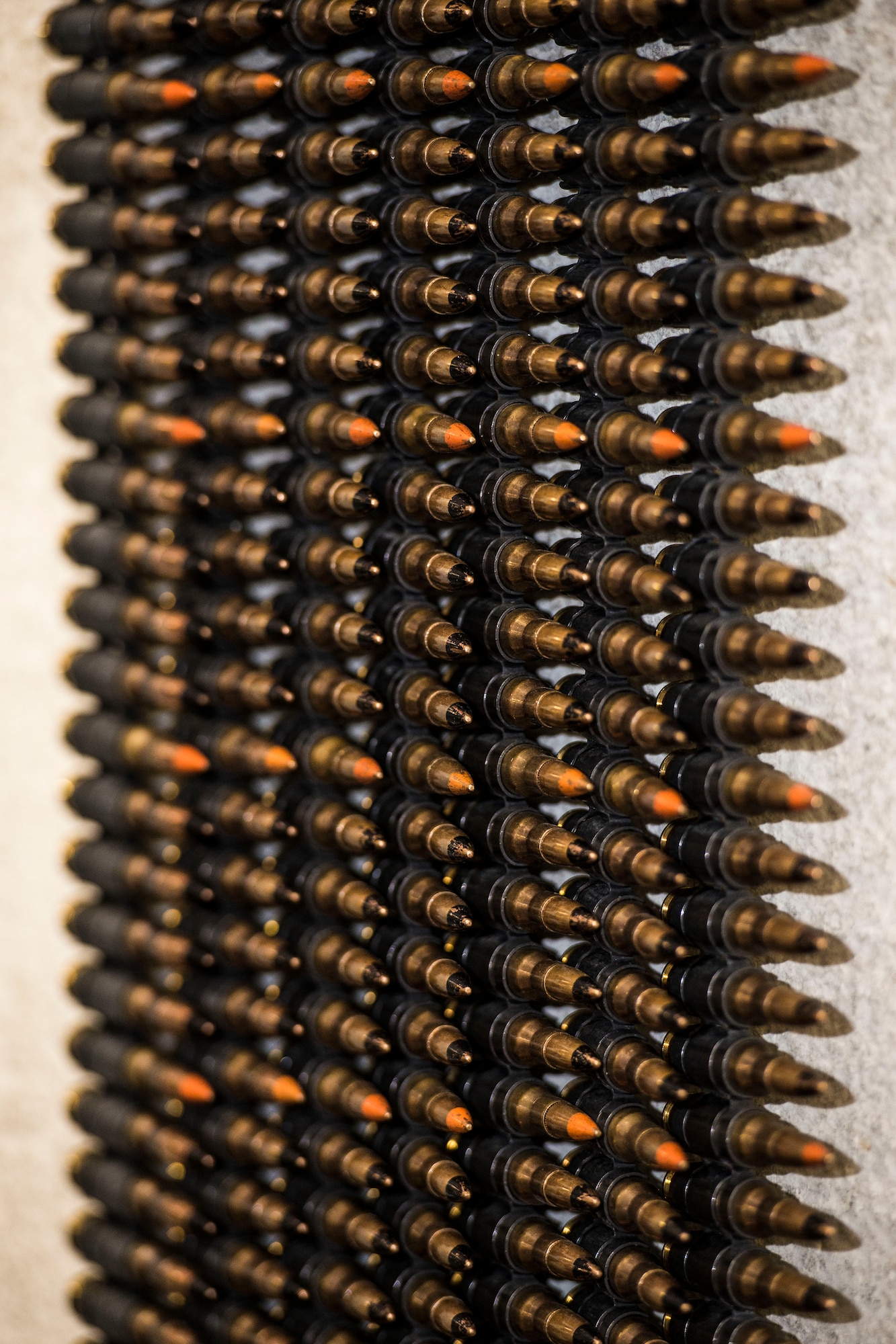 7.62 rounds hang on a wall to be counted by Airmen from the 791st Security Forces Squadron at the 5th Security Forces Armory at Minot Air Force Base, N.D., September 18, 2015. Every fifth round is a tracer, allowing the operator to better judge shot placement.(U.S. Air Force photo/ Airman 1st Class Justin T. Armstrong)