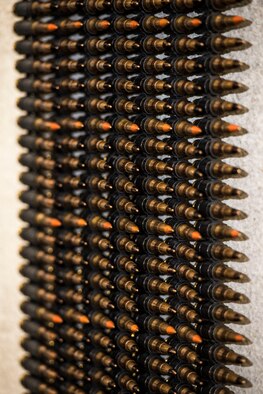 7.62 rounds hang on a wall to be counted by Airmen from the 791st Security Forces Squadron at the 5th Security Forces Armory at Minot Air Force Base, N.D., September 18, 2015. Every fifth round is a tracer, allowing the operator to better judge shot placement.(U.S. Air Force photo/ Airman 1st Class Justin T. Armstrong)