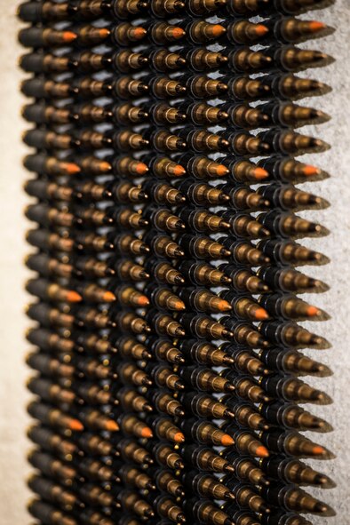 7.62 rounds hang on a wall to be counted by Airmen from the 791st Security Forces Squadron at the 5th Security Forces Armory at Minot Air Force Base, N.D., September 18, 2015. Every fifth round is a tracer, allowing the operator to better judge shot placement.(U.S. Air Force photo/ Airman 1st Class Justin T. Armstrong)