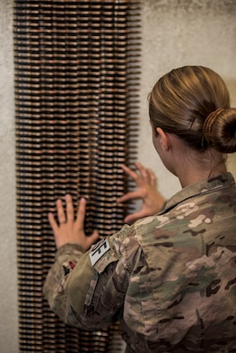 An Airman from the 791st Security Forces Squadron counts 7.62 rounds at the 5th Security Forces Armory at Minot Air Force Base, N.D., September 18, 2015. Security Forces Airmen are required to check their weapons in and out at the Armory daily. (U.S. Air Force photo/ Airman 1st Class Justin T. Armstrong)