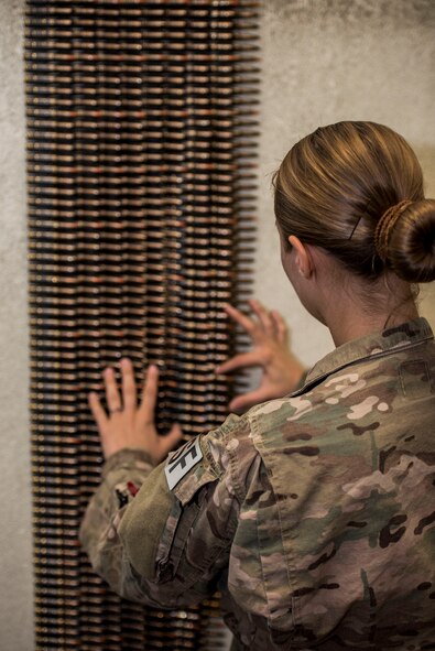 An Airman from the 791st Security Forces Squadron counts 7.62 rounds at the 5th Security Forces Armory at Minot Air Force Base, N.D., September 18, 2015. Security Forces Airmen are required to check their weapons in and out at the Armory daily. (U.S. Air Force photo/ Airman 1st Class Justin T. Armstrong)