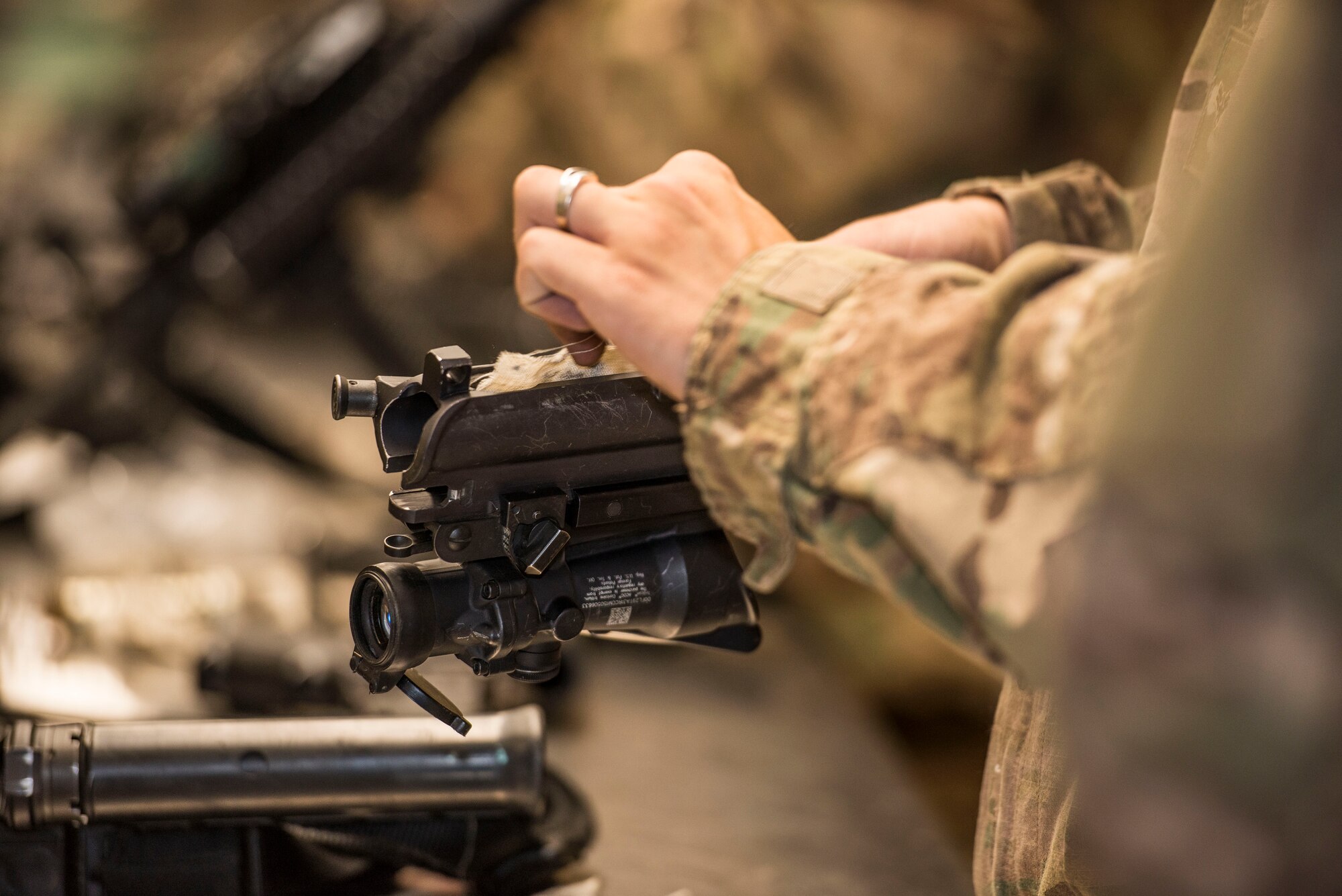 An Airman from the 791st Security Forces Squadron cleans his M4 weapon system at the 5th Security Forces Armory at Minot Air Force Base, N.D., September 18, 2015. Airmen use CLP – a cleaning chemical, brushes, and cloth wipes to remove carbon fouling cause by firing their weapons. (U.S. Air Force photo/ Airman 1st Class Justin T. Armstrong)