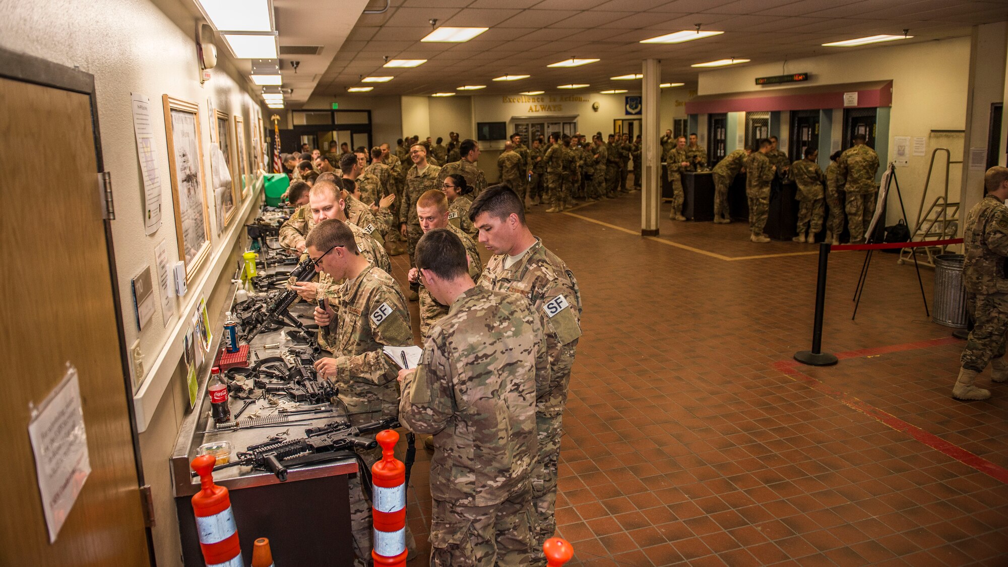 Airmen from the 791st Security Forces Squadron clean their weapons at the 5th Security Forces Armory at Minot Air Force Base, N.D., September 18, 2015. If weapons systems are not cleaned regularly, dirt, sand or carbon buildup may keep the magazine from feeding or cause the weapon to malfunction. (U.S. Air Force photo/ Airman 1st Class Justin T. Armstrong)