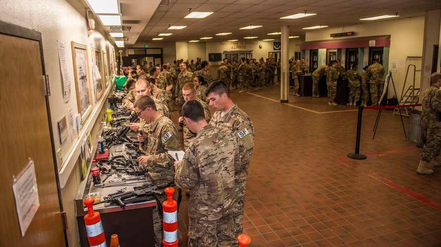 Airmen from the 791st Security Forces Squadron clean their weapons at the 5th Security Forces Armory at Minot Air Force Base, N.D., September 18, 2015. If weapons systems are not cleaned regularly, dirt, sand or carbon buildup may keep the magazine from feeding or cause the weapon to malfunction. (U.S. Air Force photo/ Airman 1st Class Justin T. Armstrong)
