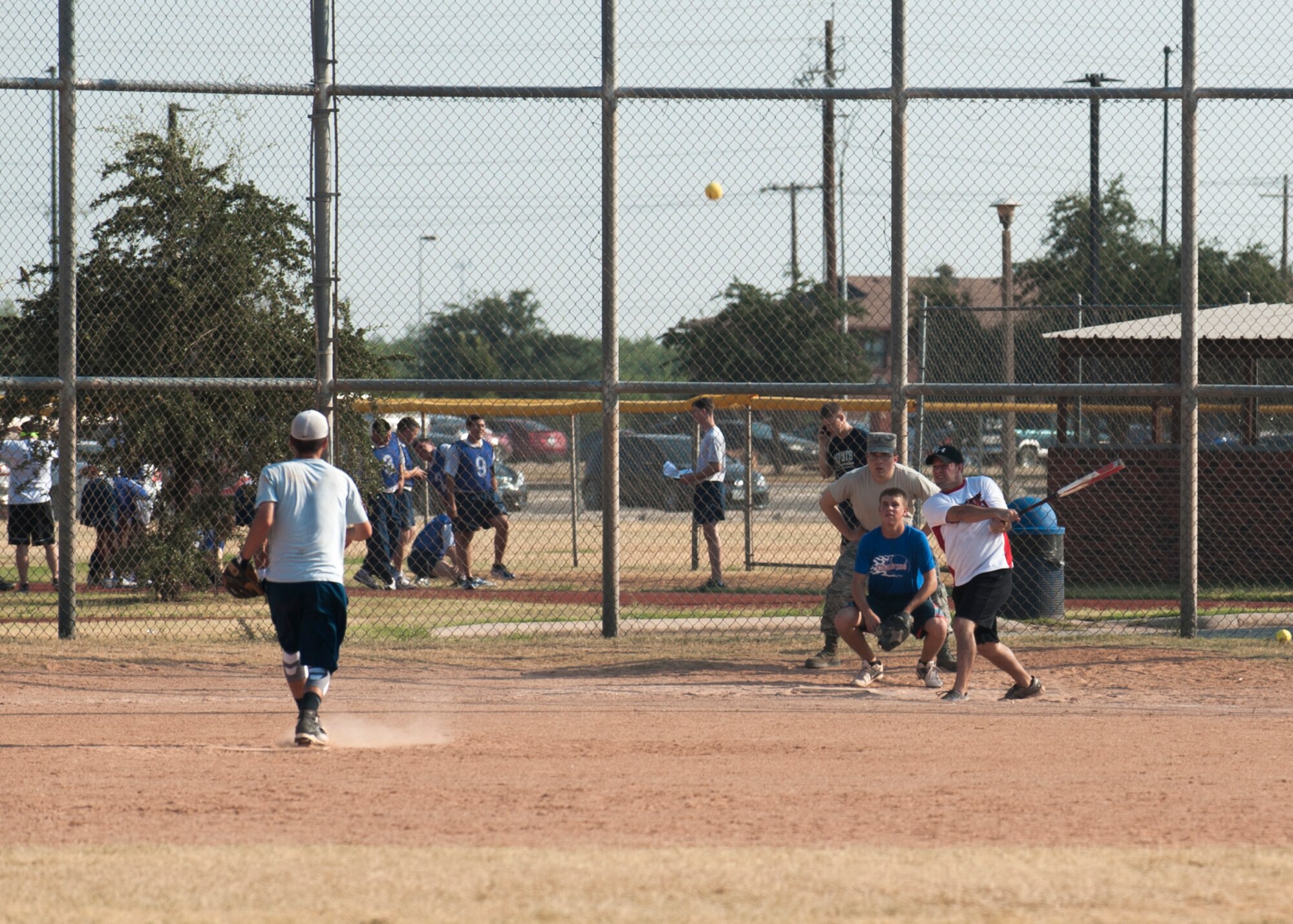 U.S. Air Force Airmen from the 7th Logistics Readiness Squadron and the 7th Maintenance Squadron play softball Aug. 27, 2015, at Dyess Air Force Base, Texas. The 7th MXS won the championship softball game during the first-ever Dyess Warrior Week. The week was dedicated to boosting morale and physical resilience through friendly competition.  (U.S. Air Force photo by Airman Quay Drawdy/Released)