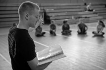 U.S. Air Force Staff Sgt. Matthew McConnell, 83rd Network Operations Squadron Detachment 4 plans and integration NCO and deputy director of Kaiserslautern Military Community Gracie Defense System, Ramstein Air Base, Germany, conducts a safety brief at the beginning of a self-defense class Sept. 15, 2015, at the Northside Fitness Center on RAF Mildenhall, England. Safety briefings are conducted at the beginning of each class to ensure all participants are aware of the risks, safety procedures and protocols involved during the training session. (U.S. Air Force photo by Staff Sgt. Micaiah Anthony/Released)  