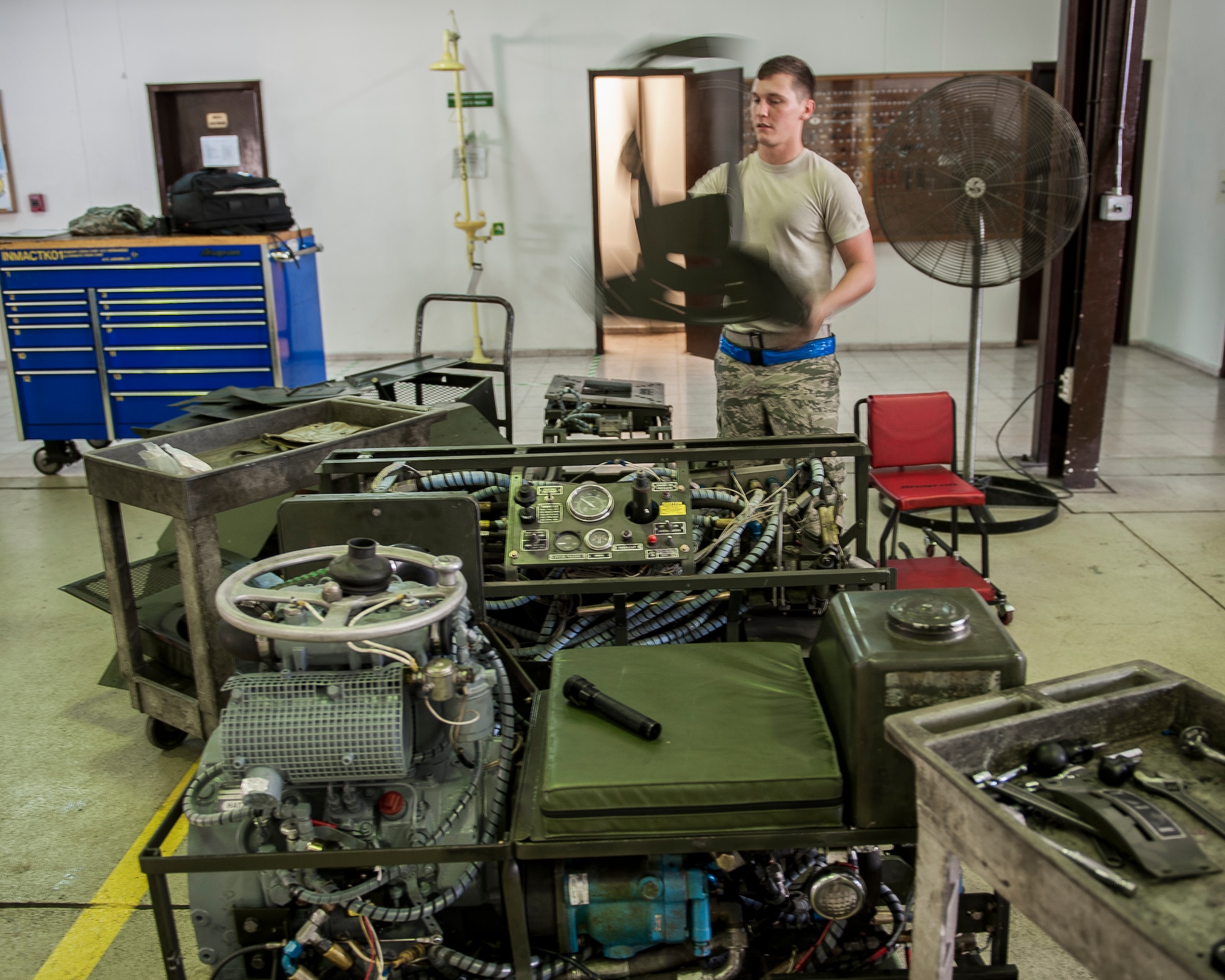 Senior Airman Michael Feagin, 39th Maintenance Squadron aerospace ground equipment technician, conducts an engine swap on a MJ-1B bomb lift Sept. 17, 2015, at Incirlik Air Base Turkey. 39th MXS AGE Airmen service, inspect, troubleshoot, repair and perform preventive maintenance on motor and engine-driven generator sets, air conditioners, hydraulic test stands, air compressors, bomb lifts, heaters and other similar support equipment. (U.S. Air Force photo by Airman 1st Class Cory W. Bush/Released)