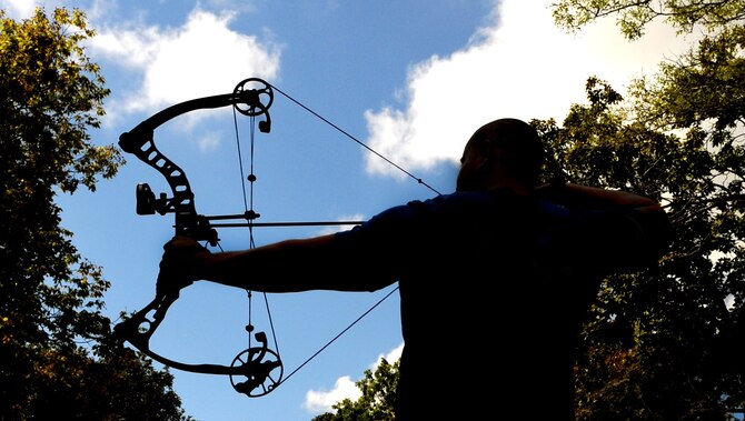 Tech. Sgt. David Hernandez, 509th Logistics Readiness Squadron resource advisor assistant, practices archery Sept. 9, 2015, in Knob Noster, Mo. Hernandez took third place in an archery competition against wounded warriors like himself. Hernandez has been practicing archery since he was young. (U.S. Air Force photo by Airman 1st Class Michaela R. Slanchik/Released)